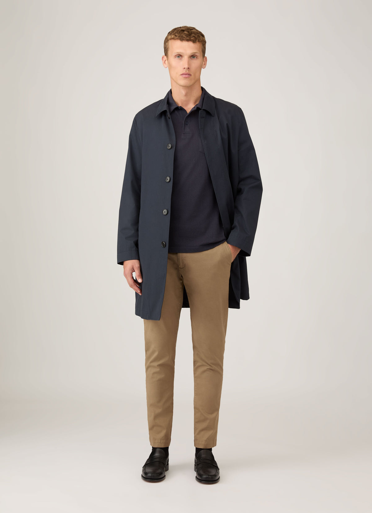 Sunspel Riviera Polo in navy — styled with a coat